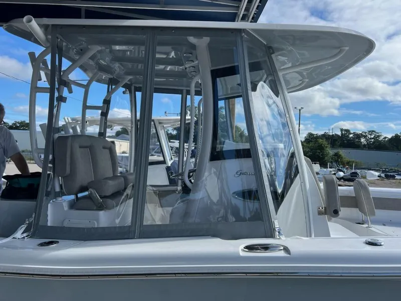 Slide: The Image of 2025 Sea Hunt Gamefish 28 Forward Seating boat with enclosed helm and seating area. - 14