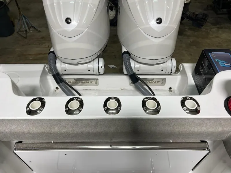 Slide: The Image of 2025 Sea Hunt Gamefish 28 boat with dual engines and rod holders. - 15