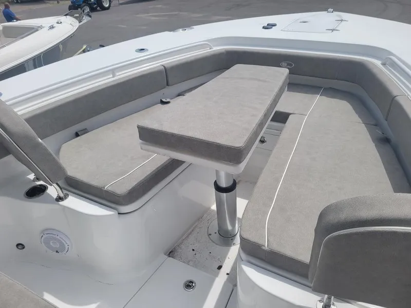 Slide: The Image of 2025 Sea Hunt Gamefish 28 Forward Seating with cushioned benches and table. - 5