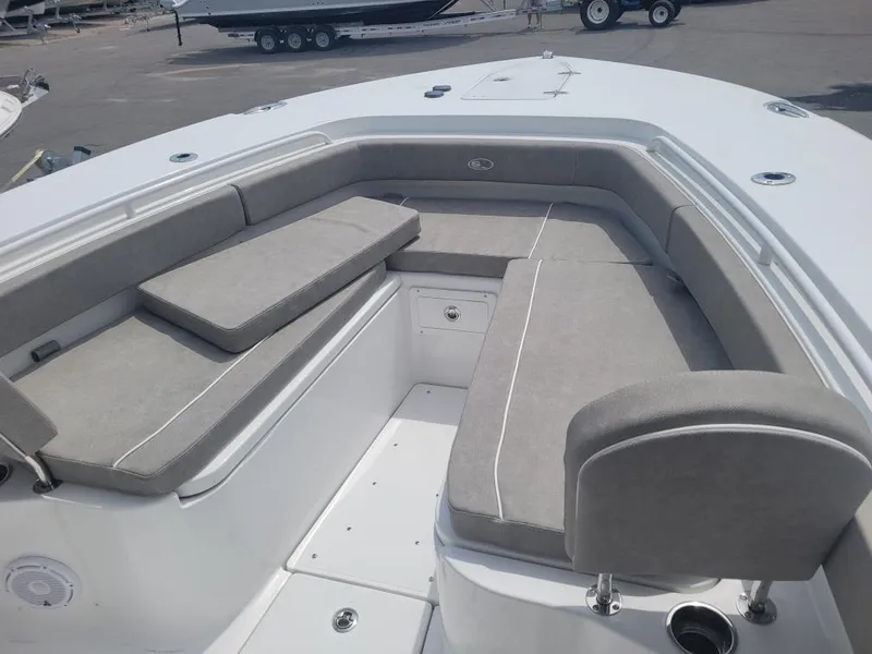 Slide: The Image of 2025 Sea Hunt Gamefish 28 Forward Seating with gray cushions and spacious deck layout. - 6
