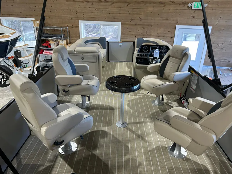 Slide: The Image of Interior of 2025 Godfrey Sweetwater 2286 QS pontoon boat with plush seating and modern dashboard. - 3