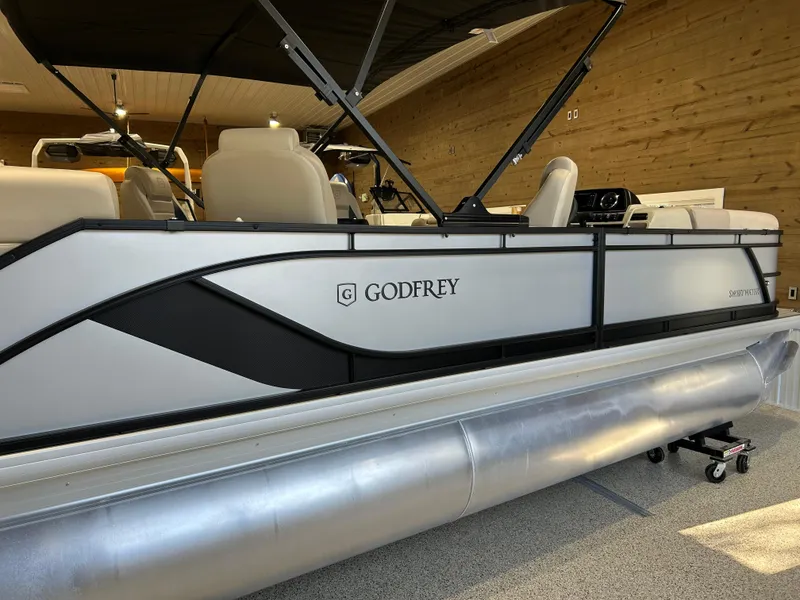 Slide: The Image of 2025 Godfrey Sweetwater 2286 QS pontoon boat in showroom, side view. - 9