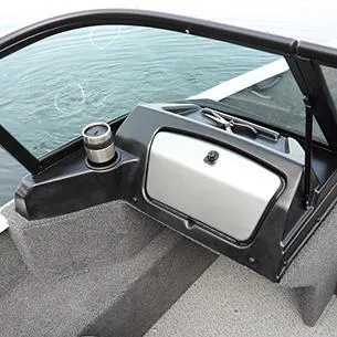 Slide: The Image of 2025 Lund 1650 Rebel XL SS boat dashboard with cup holder and storage compartment. - 12