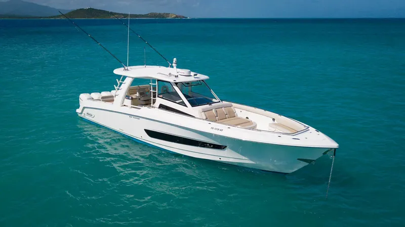 The Image of 2019 Boston Whaler 420 Outrage boat on turquoise water, showcasing luxury and performance. - 1