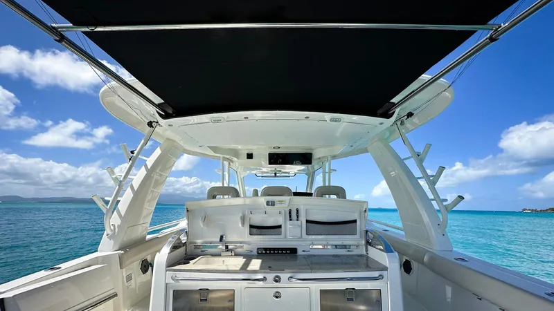 Slide: The Image of 2019 Boston Whaler 420 Outrage boat interior with ocean view and clear blue sky. - 16