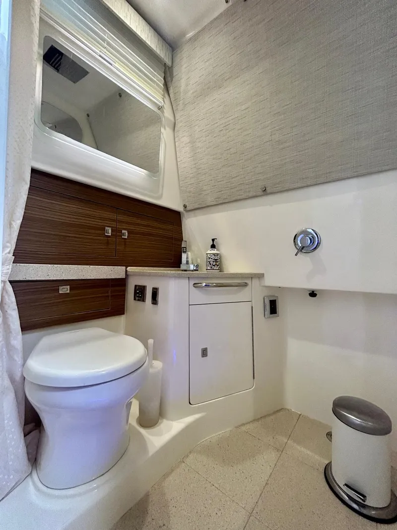 Slide: The Image of 2019 Boston Whaler 420 Outrage bathroom with modern fixtures and sleek design. - 9