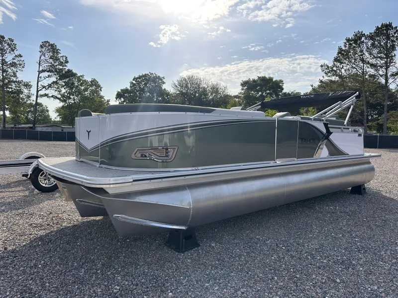 The Image of 2025 Tahoe Pontoon LTZ Cruise Rear Bench on gravel lot, under clear sky. - 0