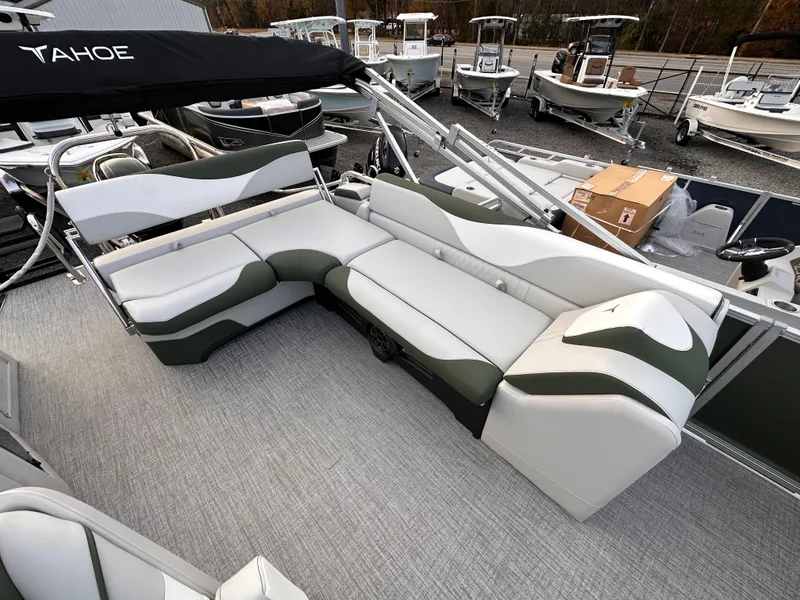 Slide: The Image of 2025 Tahoe Pontoon LTZ Cruise Rear Bench with stylish seating on a boat deck. - 2