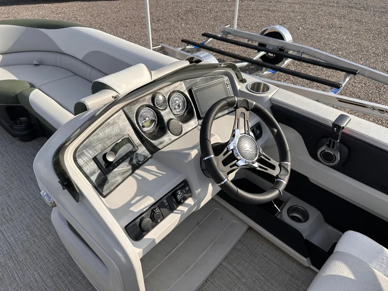 Slide: The Image of 2025 Tahoe Pontoon LTZ Cruise Rear Bench dashboard with steering wheel and controls. - 6