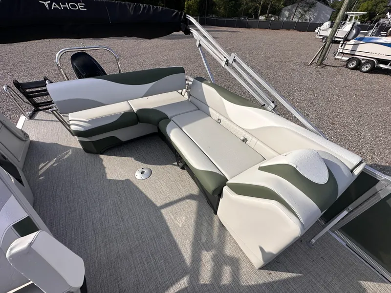 Slide: The Image of 2025 Tahoe Pontoon LTZ Cruise Rear Bench with stylish seating on a sunny day. - 7