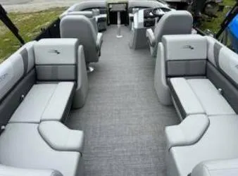 Slide: The Image of 2025 Bennington 22 SXSR pontoon boat interior with gray seating and modern design. - 11