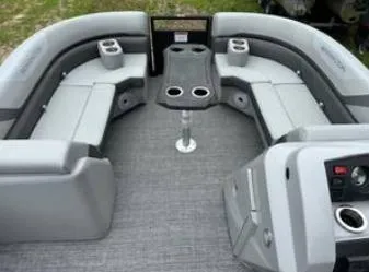 Slide: The Image of 2025 Bennington 22 SXSR pontoon boat interior with gray seating and cup holders. - 4