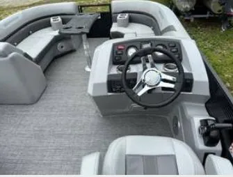 Slide: The Image of 2025 Bennington 22 SXSR boat interior with steering wheel and seating area. - 6