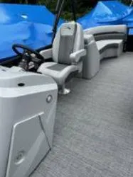 Slide: The Image of 2025 Bennington 22 SXSR boat interior with gray seating and steering console. - 8