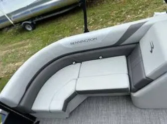 Slide: The Image of 2025 Bennington 22 SXSR boat interior with gray and white cushioned seating. - 9