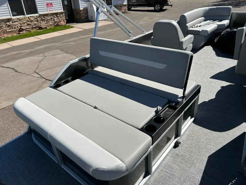Slide: The Image of 2025 Godfrey Xperience 2286 SFL pontoon boat with gray seating and cup holders. - 4