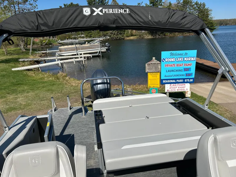 Slide: The Image of 2025 Godfrey Xperience 2286 SFL pontoon boat at Round Lake Marina dock. - 5