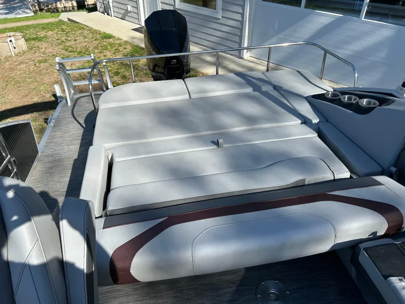 Slide: The Image of 2022 Bennington 22 SX SBST pontoon boat with spacious seating and modern design. - 10