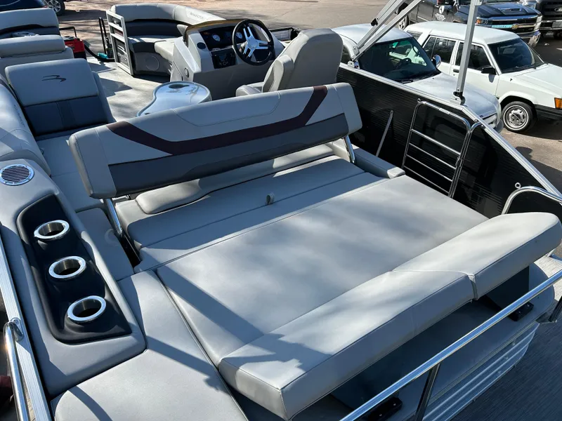 Slide: The Image of 2022 Bennington 22 SX SBST pontoon boat with spacious seating and modern design. - 9