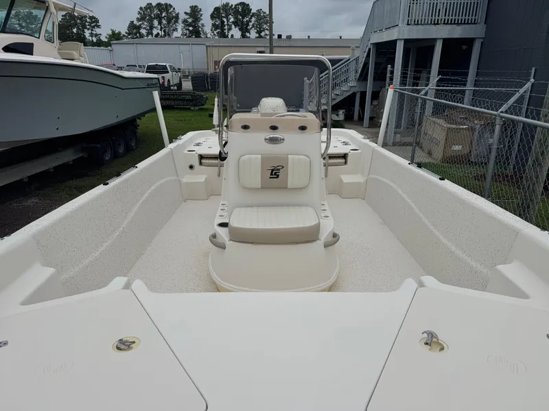 Slide: The Image of 2018 Carolina Skiff 198 DLV boat interior, featuring center console and seating. - 3