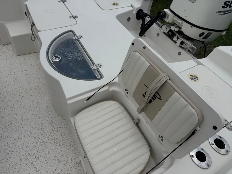 Slide: The Image of 2018 Carolina Skiff 198 DLV boat interior with seating and motor detail. - 6