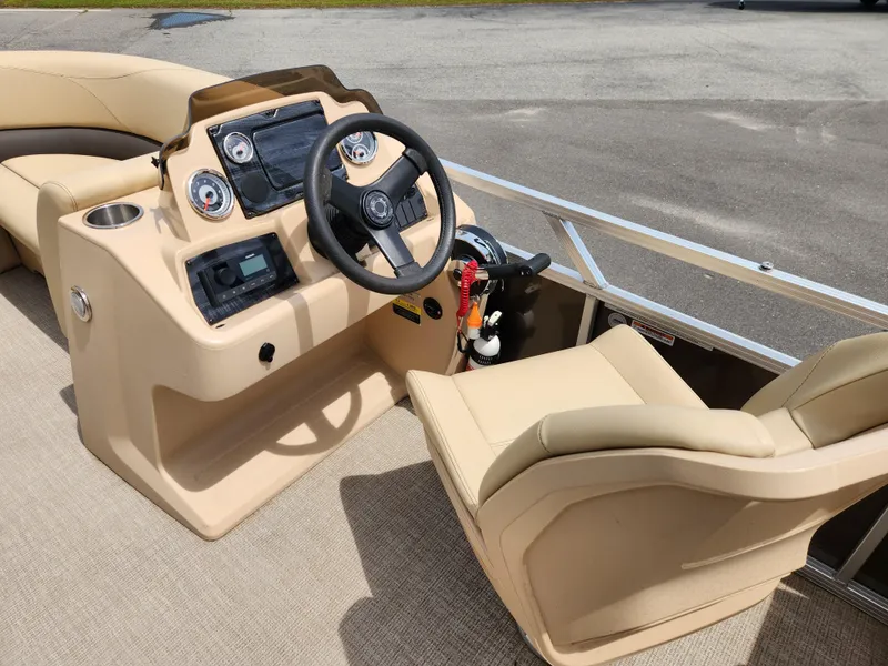 Slide: The Image of 2022 Avalon VLS 2080 QL boat dashboard with steering wheel and controls. - 11