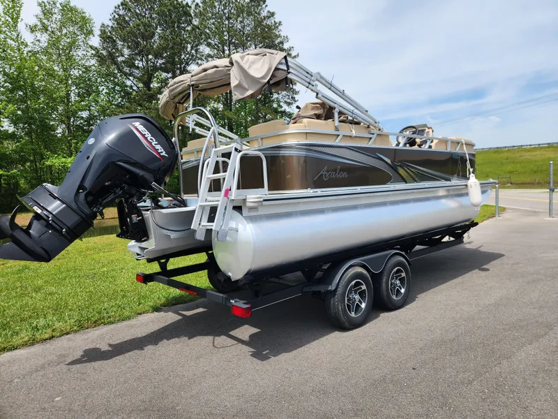Slide: The Image of 2022 Avalon VLS 2080 QL pontoon boat on trailer with outboard motor. - 2