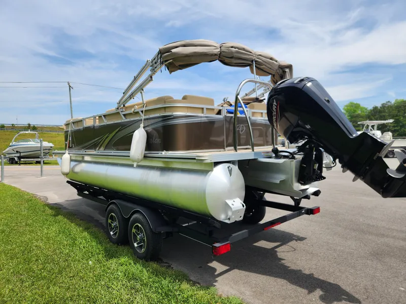 Slide: The Image of 2022 Avalon VLS 2080 QL pontoon boat on trailer, parked outdoors. - 3