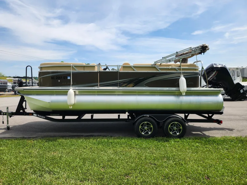 Slide: The Image of 2022 Avalon VLS 2080 QL pontoon boat on trailer, parked on grass. - 5