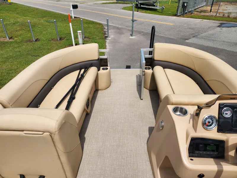 Slide: The Image of 2022 Avalon VLS 2080 QL pontoon boat interior with beige seating and control panel. - 7