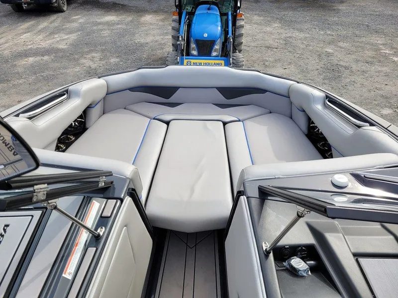 Slide: The Image of 2022 Moomba Makai boat interior with gray seating and modern design. - 11