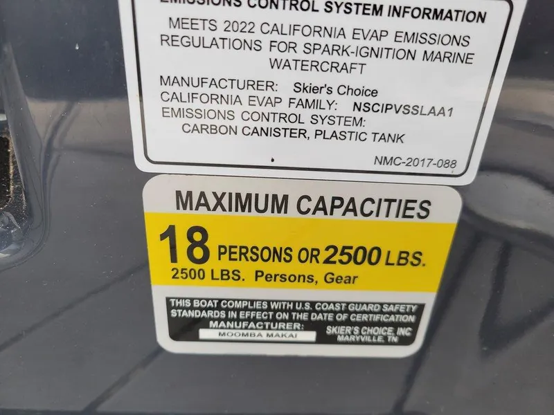 Slide: The Image of 2022 Moomba Makai capacity label: 18 persons or 2500 lbs, U.S. Coast Guard compliant. - 14