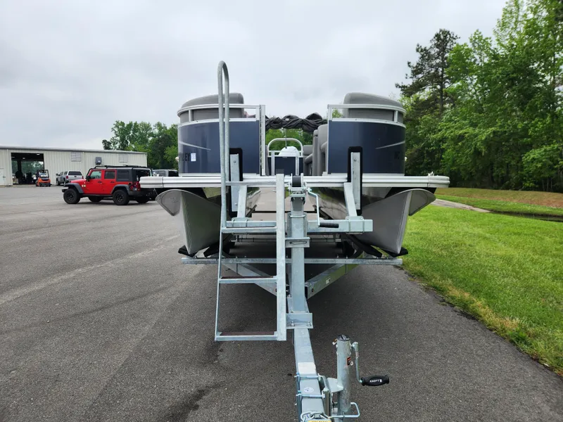 Slide: The Image of 2022 Avalon VLS 2280 QL pontoon boat on trailer, parked outdoors. - 7