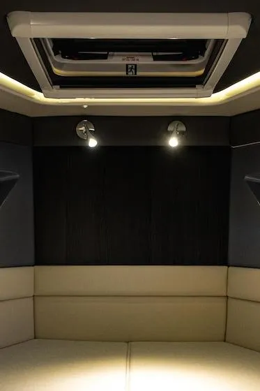 Slide: The Image of Interior of 2025 Navan C30, featuring modern lighting and sleek design. - 14
