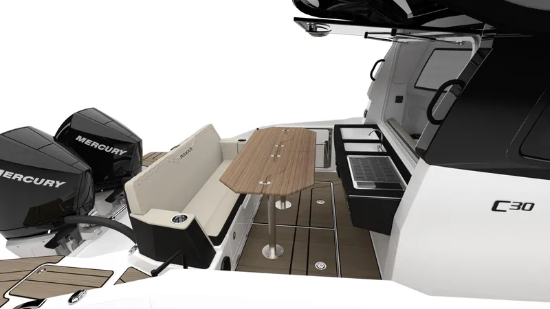 Slide: The Image of 2025 Navan C30 boat interior with seating, table, and dual Mercury engines. - 30
