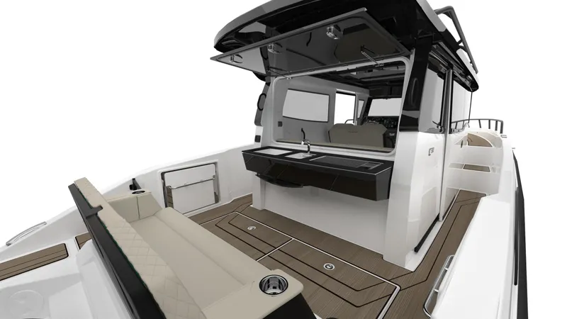 Slide: The Image of 2025 Navan C30 boat interior with sleek design, featuring seating and a compact kitchenette. - 31
