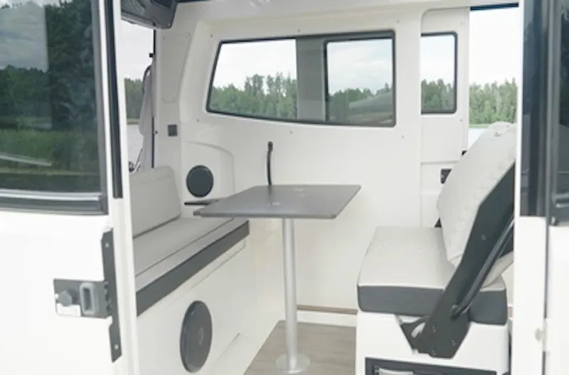 Slide: The Image of Interior of 2025 Navan C30 boat with seating and table, featuring modern design. - 8