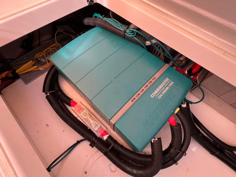 Slide: The Image of Electrical system in 2024 Aquador 250 HT boat, featuring a CombiMaster inverter. - 35