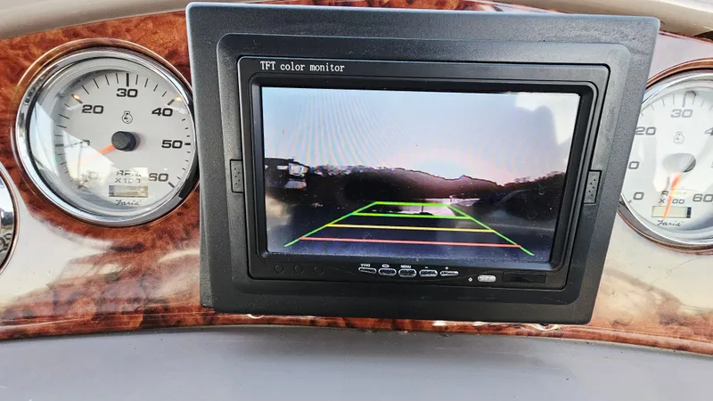 Slide: The Image of Dashboard of 2005 Rinker 300 Express Cruiser with TFT color monitor and gauges. - 14