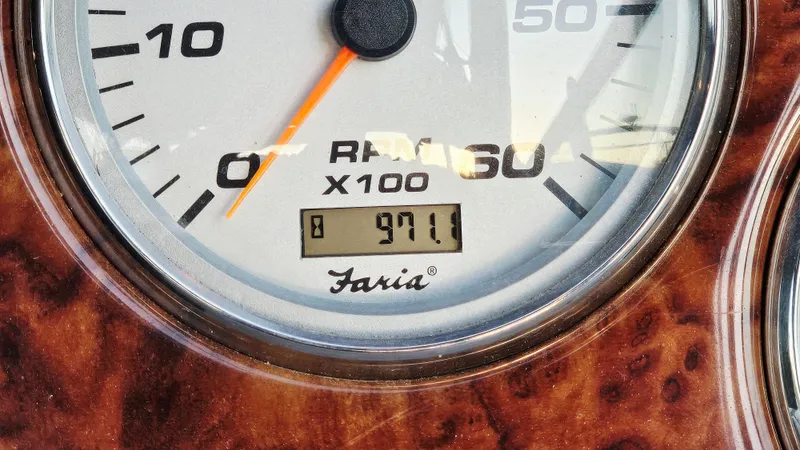 Slide: The Image of Close-up of a 2005 Rinker 300 Express Cruiser RPM gauge showing 971.1 hours. - 26