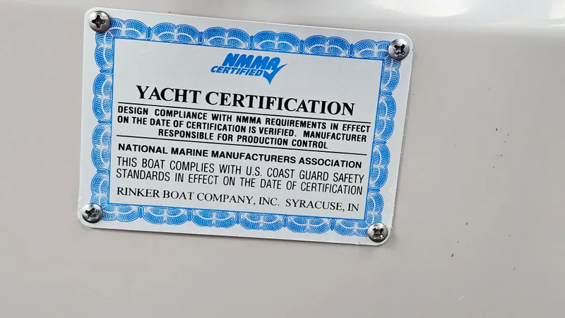 Slide: The Image of Yacht certification plaque for 2005 Rinker 300 Express Cruiser by NMMA. - 27