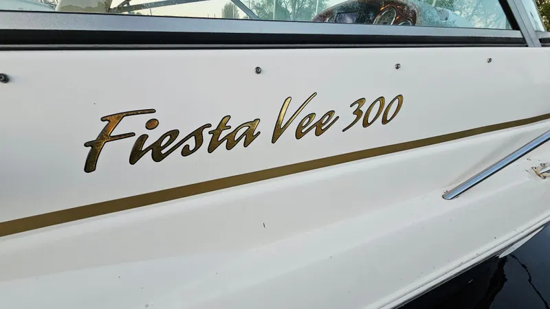 Slide: The Image of 2005 Rinker 300 Express Cruiser, Fiesta Vee 300 branding on the side. - 28
