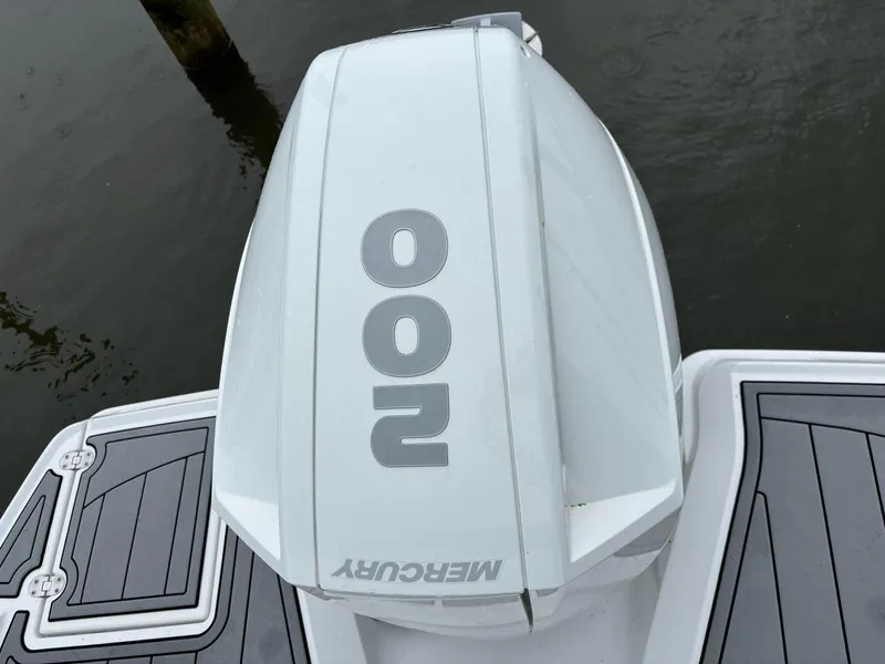 Slide: The Image of Outboard motor on 2022 Monterey M-225 boat, featuring Mercury 200 engine. - 16