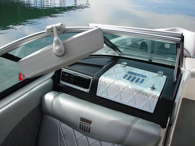 Slide: The Image of Interior of a 2014 MasterCraft X46 boat with silver upholstery and dashboard details. - 11