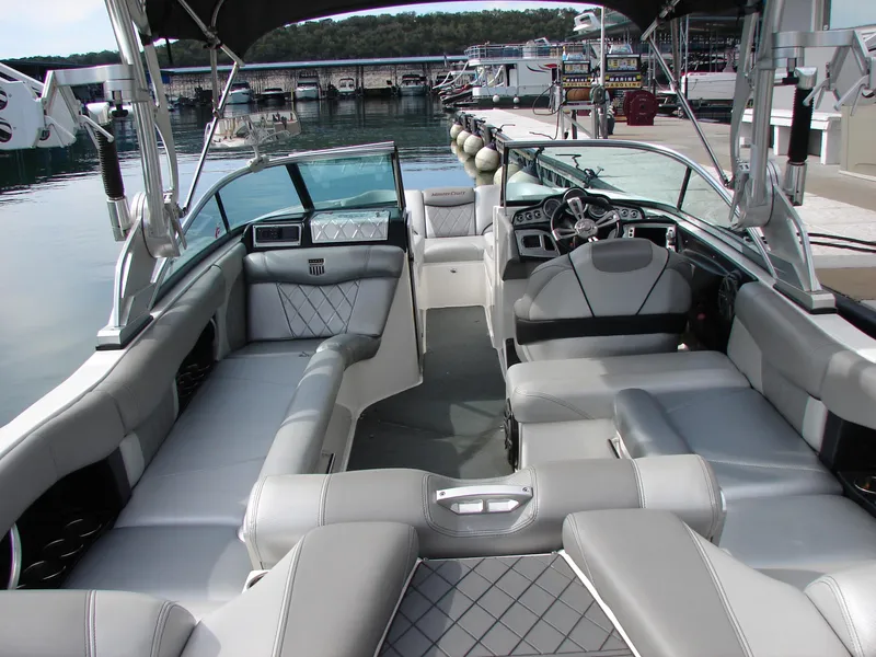 Slide: The Image of 2014 MasterCraft X46 boat interior with luxurious seating and modern dashboard. - 14