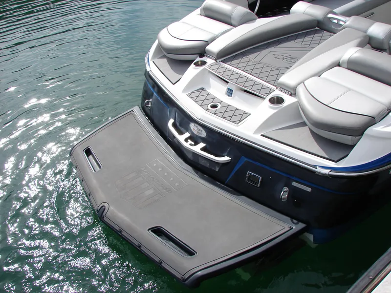 Slide: The Image of 2014 MasterCraft X46 boat with swim platform on calm water. - 20