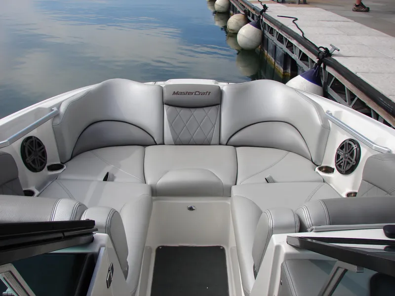 Slide: The Image of 2014 MasterCraft X46 boat interior with plush seating and waterfront view. - 5
