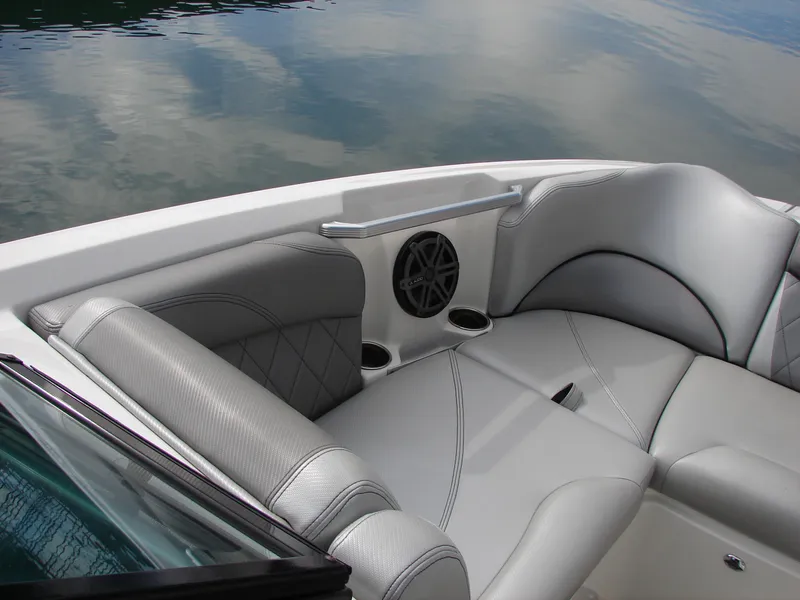 Slide: The Image of 2014 MasterCraft X46 boat interior with gray seating and speaker. - 7