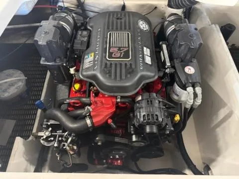 Slide: The Image of 2006 Monterey 234FS engine compartment with a 5.7 GXi motor, showcasing detailed components. - 18