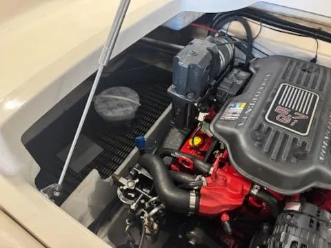 Slide: The Image of Engine compartment of a 2006 Monterey 234FS boat, showcasing detailed components. - 20